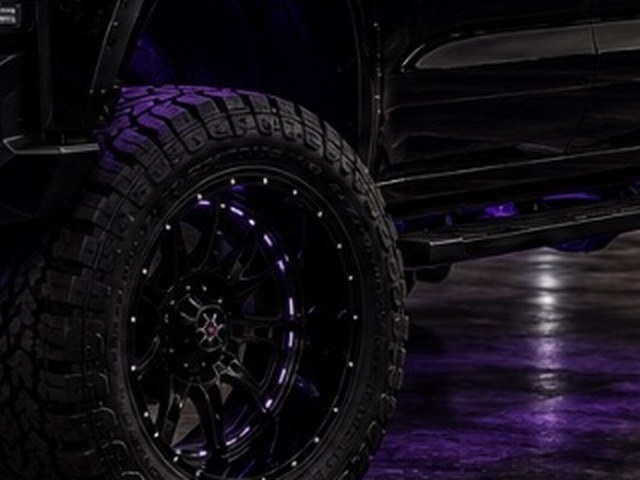 Aftermarket wheel and tire package with rock lighting